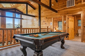 Challenge your friends to a game on your private billiard table, surrounded by vaulted pine ceilings and sweeping mountain vistas through panoramic windows.