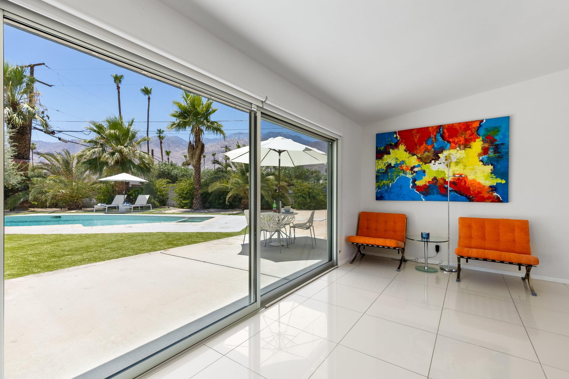 Sliding glass doors off of the living room bring the outside, in