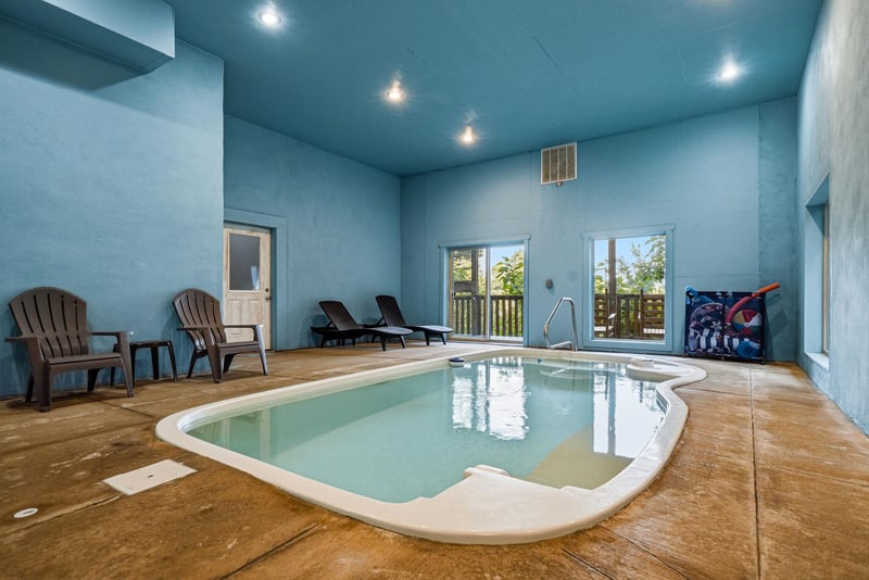 Soak away your cares in your private indoor pool, complete with lounge chairs and serene natural light streaming through large windows—perfect for relaxing any time of year.