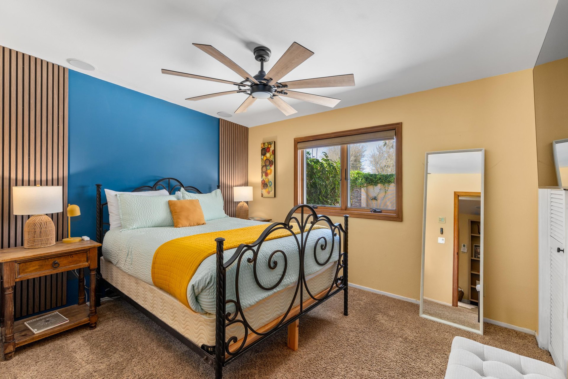 Queen size bed and flatscreen TV. Bedroom is located next to game roommedia room.