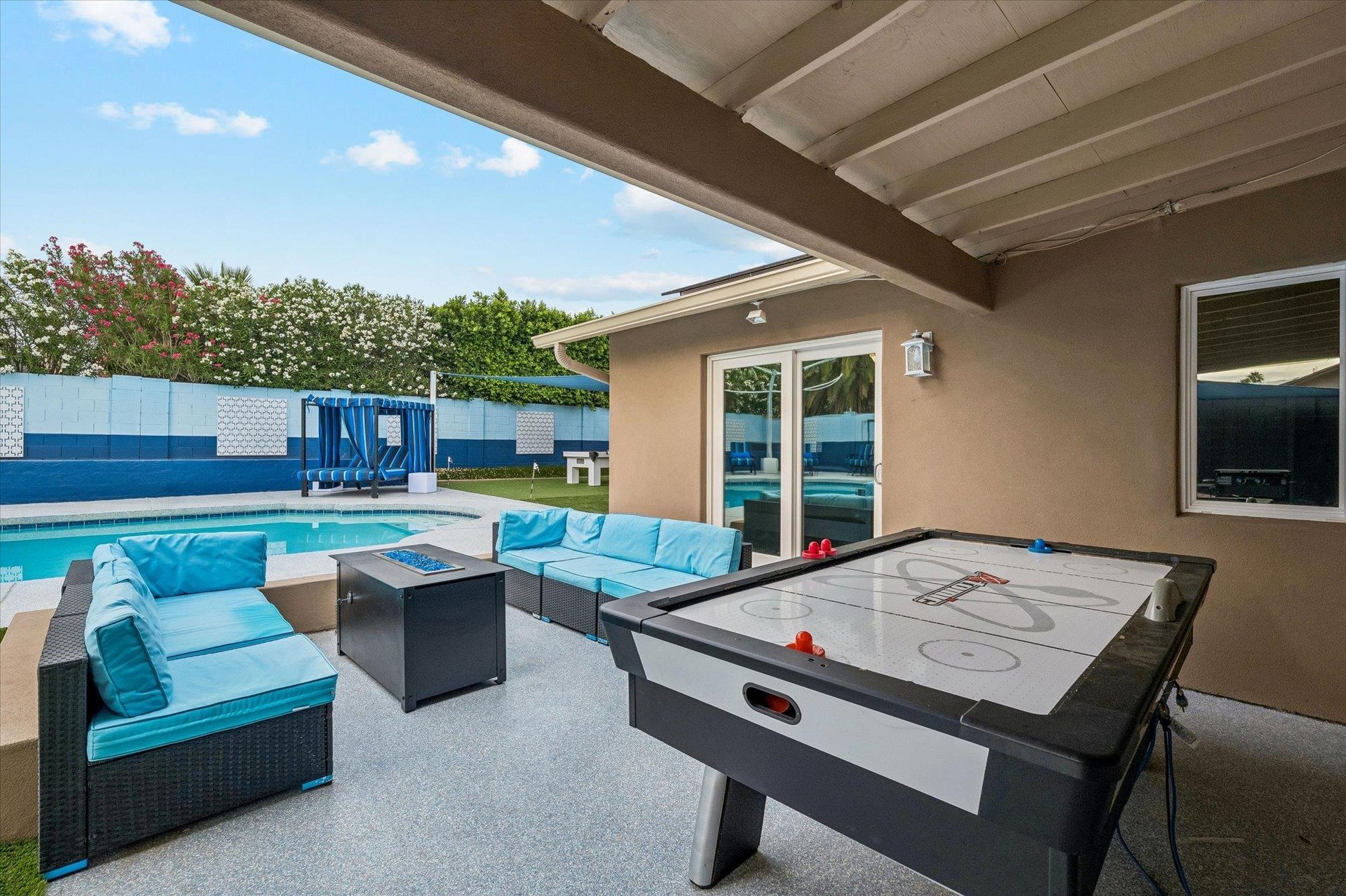 Plenty of outdoor seating, firepit, and air hockey table.