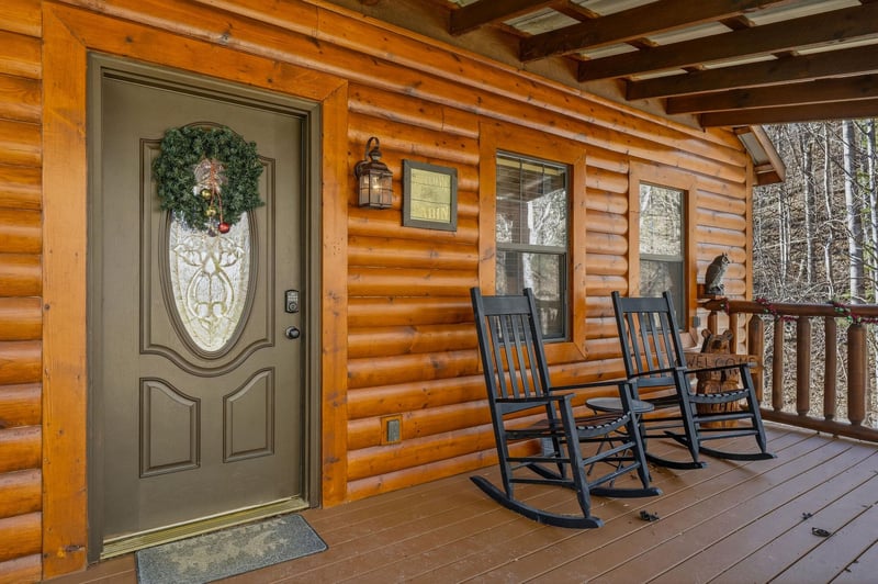Settle into your rocking chair on this welcoming covered porch, where rustic charm meets mountain serenity for peaceful mornings and evenings.