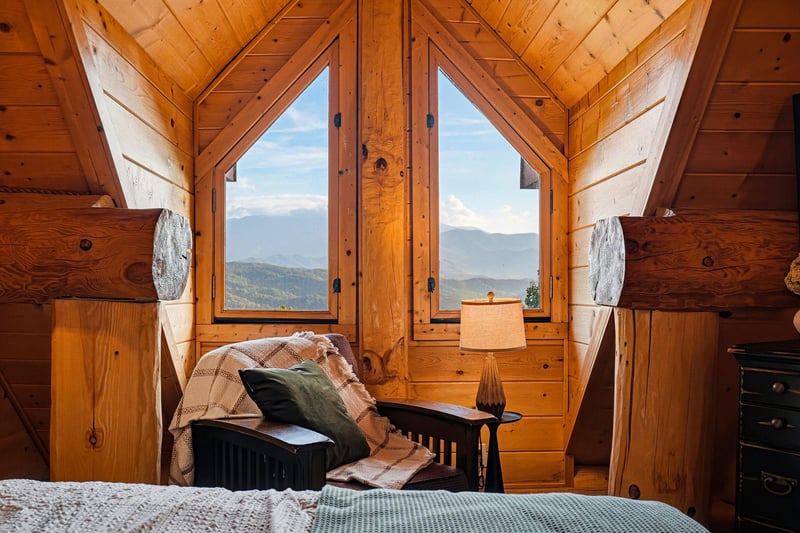 Wake up to stunning mountain vistas right from your cozy bedroom. The soaring woodbeamed ceiling and picture windows frame layers of peaks, inviting you to start each morning surrounded by natures b