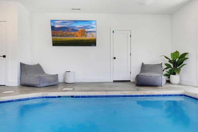 Unwind in your own private indoor pool, complete with cozy loungers and a calming ambiance perfect for relaxation.
