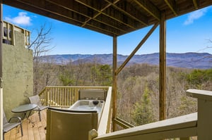 Soak in your private hot tub while taking in breathtaking mountain vistas that stretch endlessly before you.