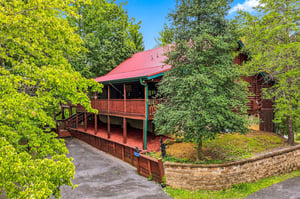 A charming cabinstyle retreat tucked into lush greenery, offering peaceful seclusion with nature at your doorstep.