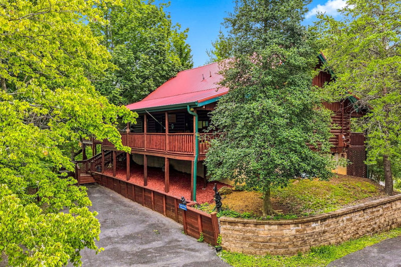 A charming cabinstyle retreat tucked into lush greenery, offering peaceful seclusion with nature at your doorstep.