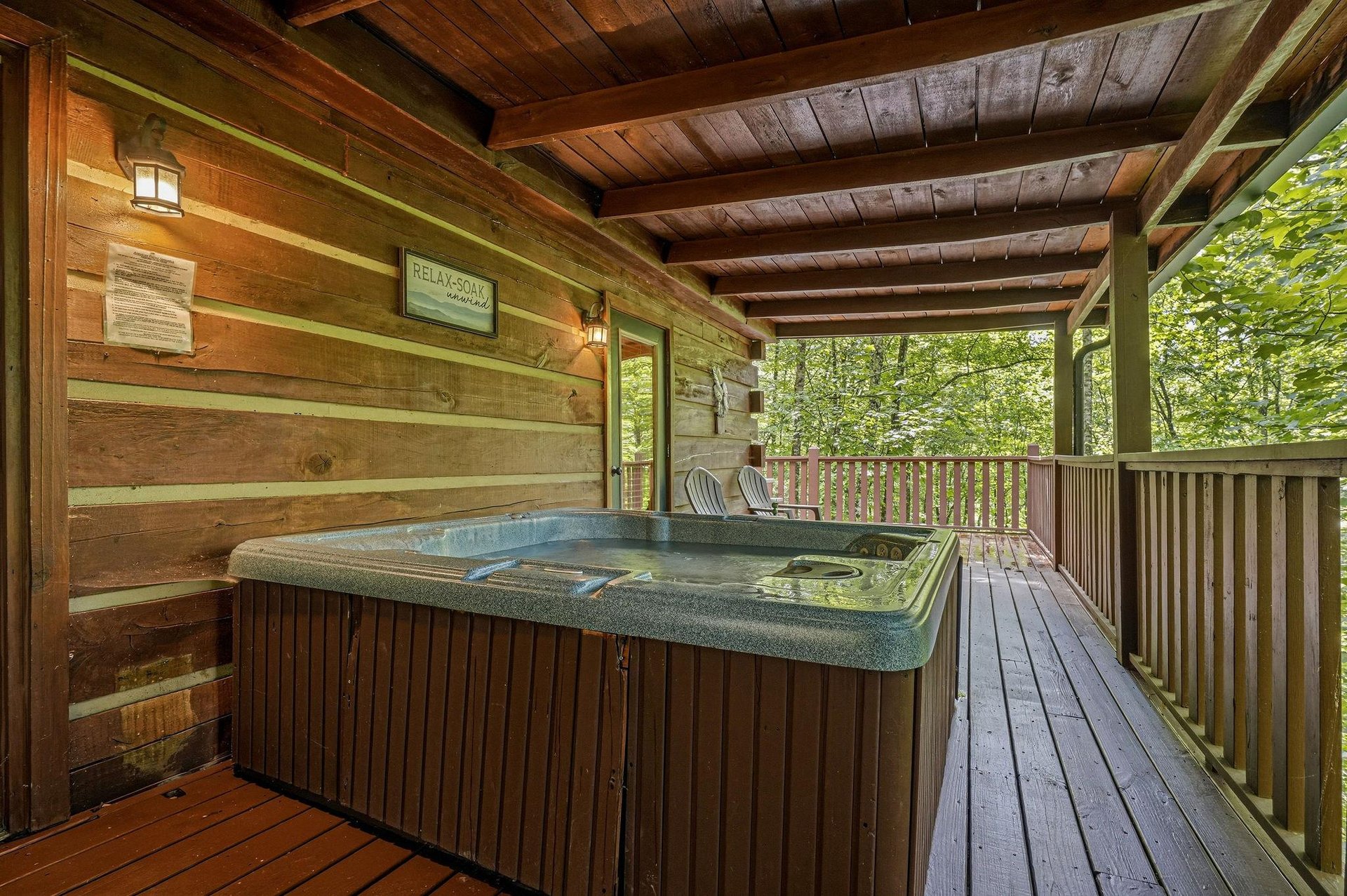 Slip into your private hot tub surrounded by lush forest views, where warm jets and the rustle of leaves create your perfect mountain retreat.