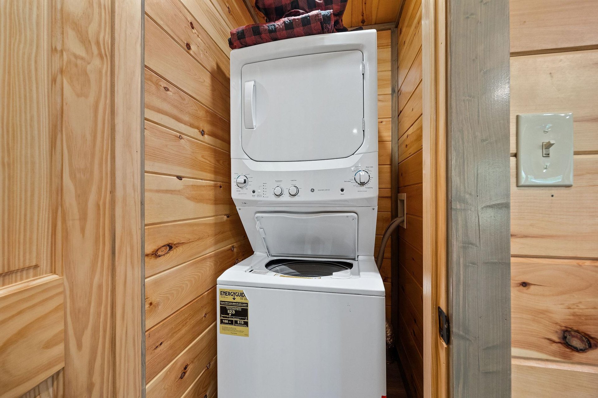 stackable washer and dryer in closet on lower level