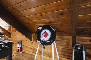 Your cozy cabin retreat features warm woodpaneled walls and a space heater to keep you comfortable during cooler mountain evenings.