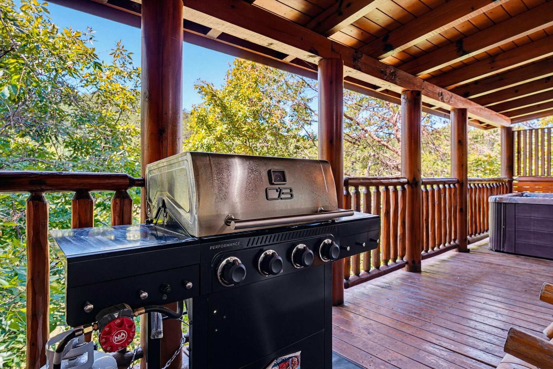 Fire up the grill on your private covered deck and breathe in the fresh mountain air as sunlight filters through the trees around you.