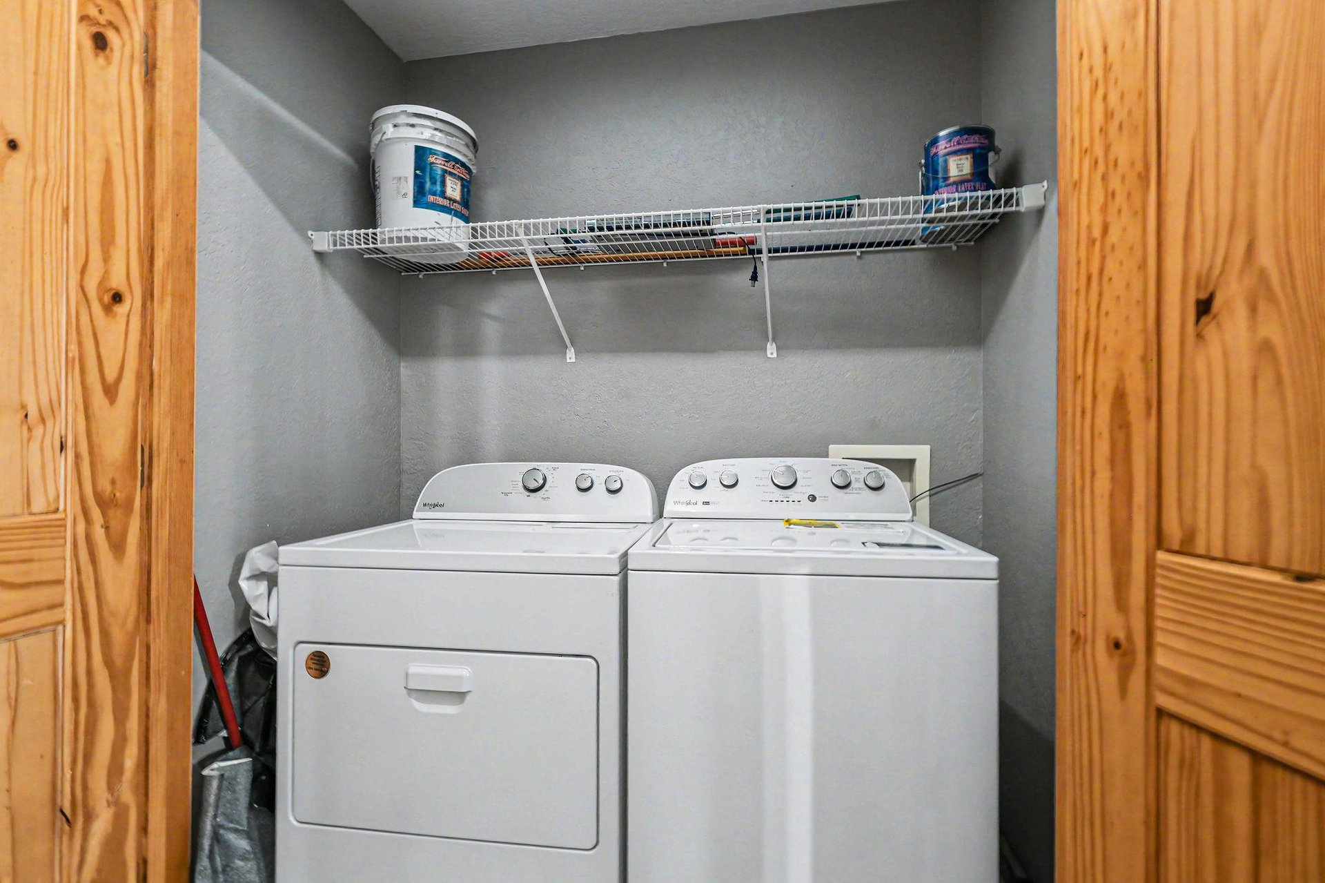 Your dedicated laundry nook makes extended stays effortless with fullsize washer and dryer plus convenient storage shelving.