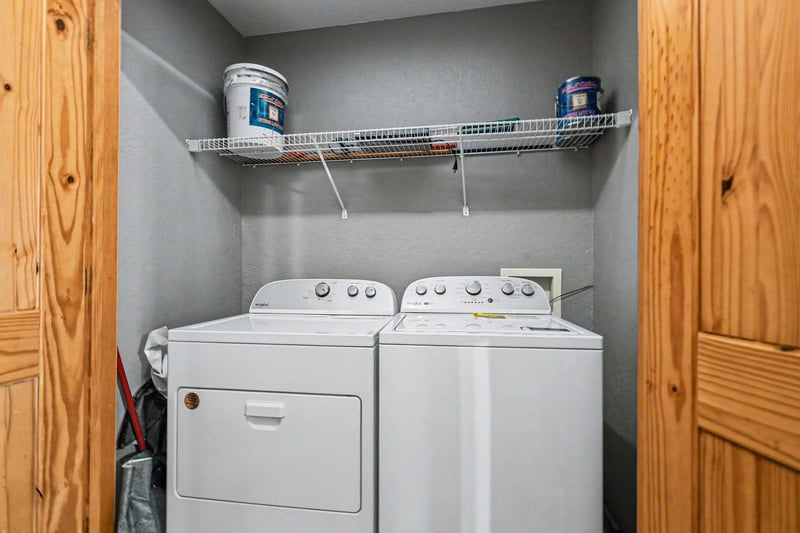 Your dedicated laundry nook makes extended stays effortless with fullsize washer and dryer plus convenient storage shelving.