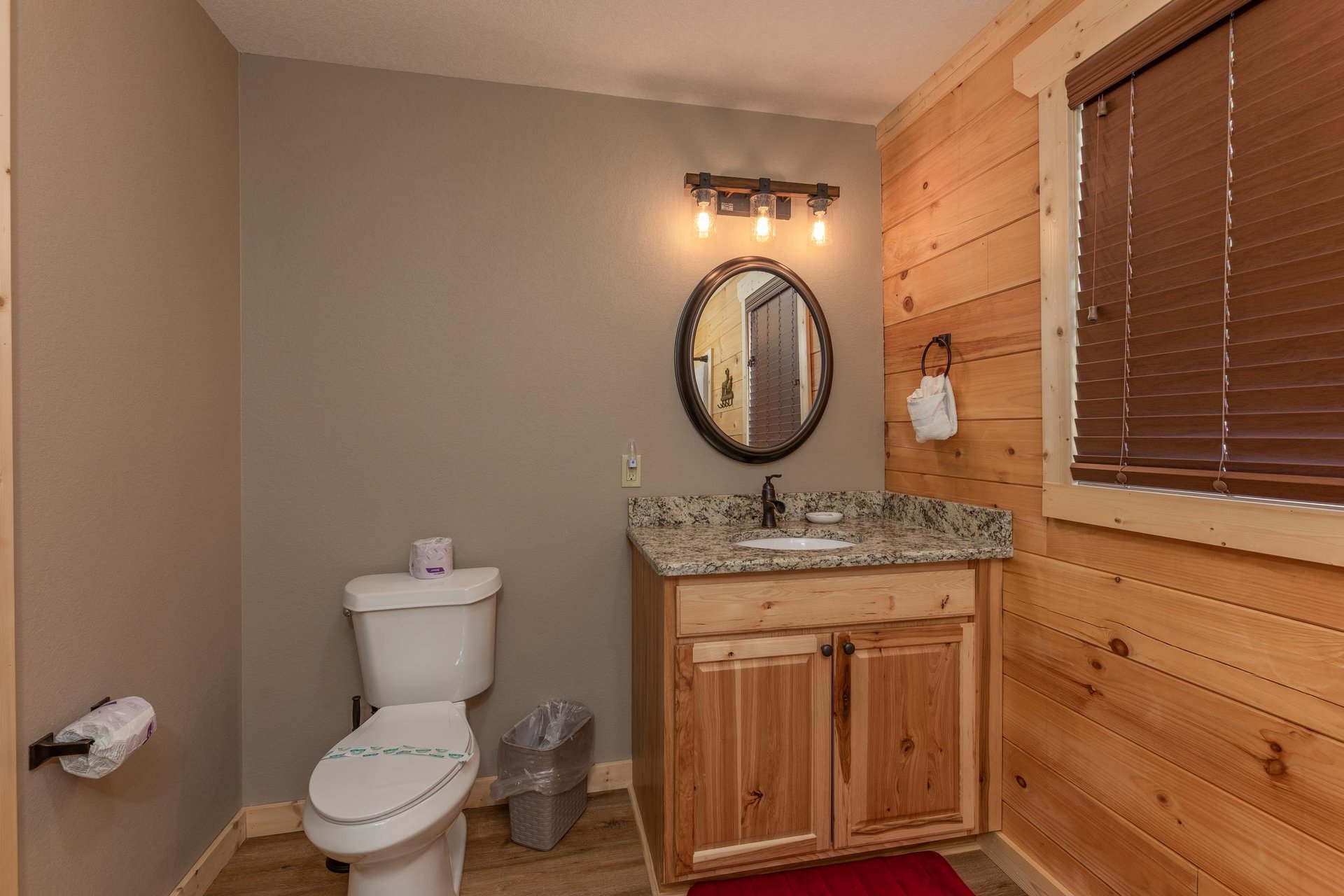 Single vanity sink with oval mirror