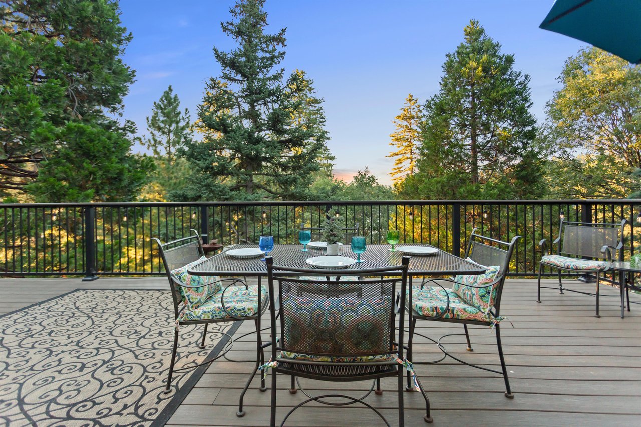 Upstairs deck features outdoor dining with a view.