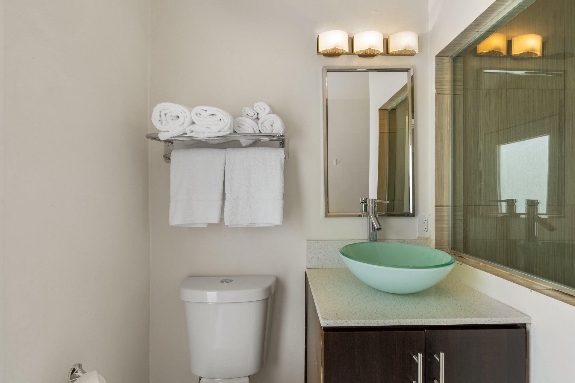 Full guest bathroom with a walkin shower.