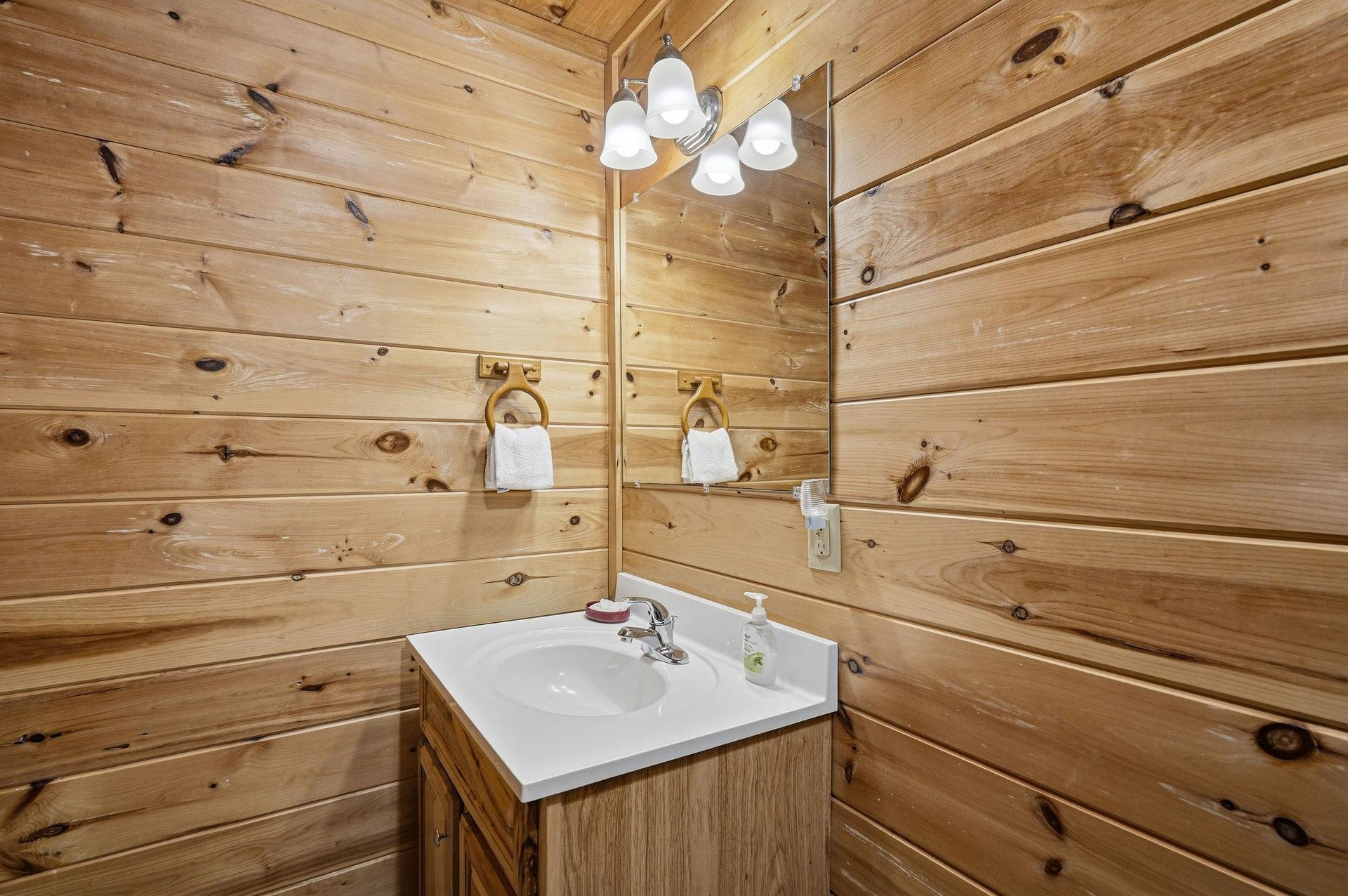 Warm wood planks surround your private vanity, where thoughtful touches await your morning routine.