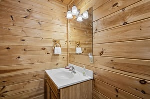 Warm wood planks surround your private vanity, where thoughtful touches await your morning routine.