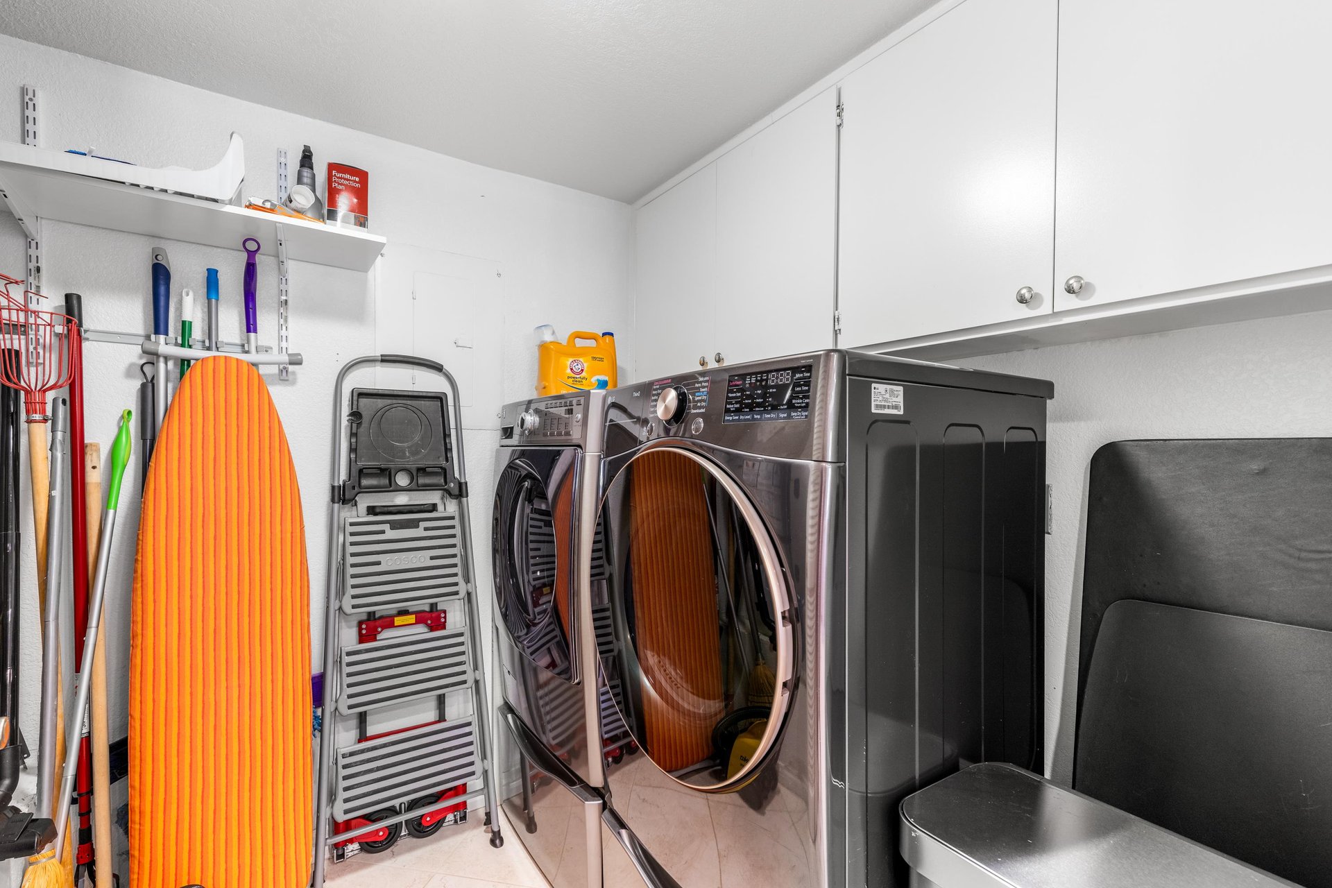 Washerdryer and cleaning supplies for guest use.