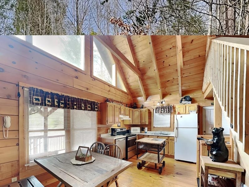 Step into your cozy cabin retreat where rustic wood warmth meets modern comfort. Sunlight pours through skylights onto your fullyequipped kitchen, inviting you to cook and gather around the handcraft