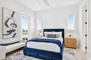 Relax in this inviting firstfloor queen bedroom featuring a comfortable queen bed and a private exterior entry door for added convenience and privacy.