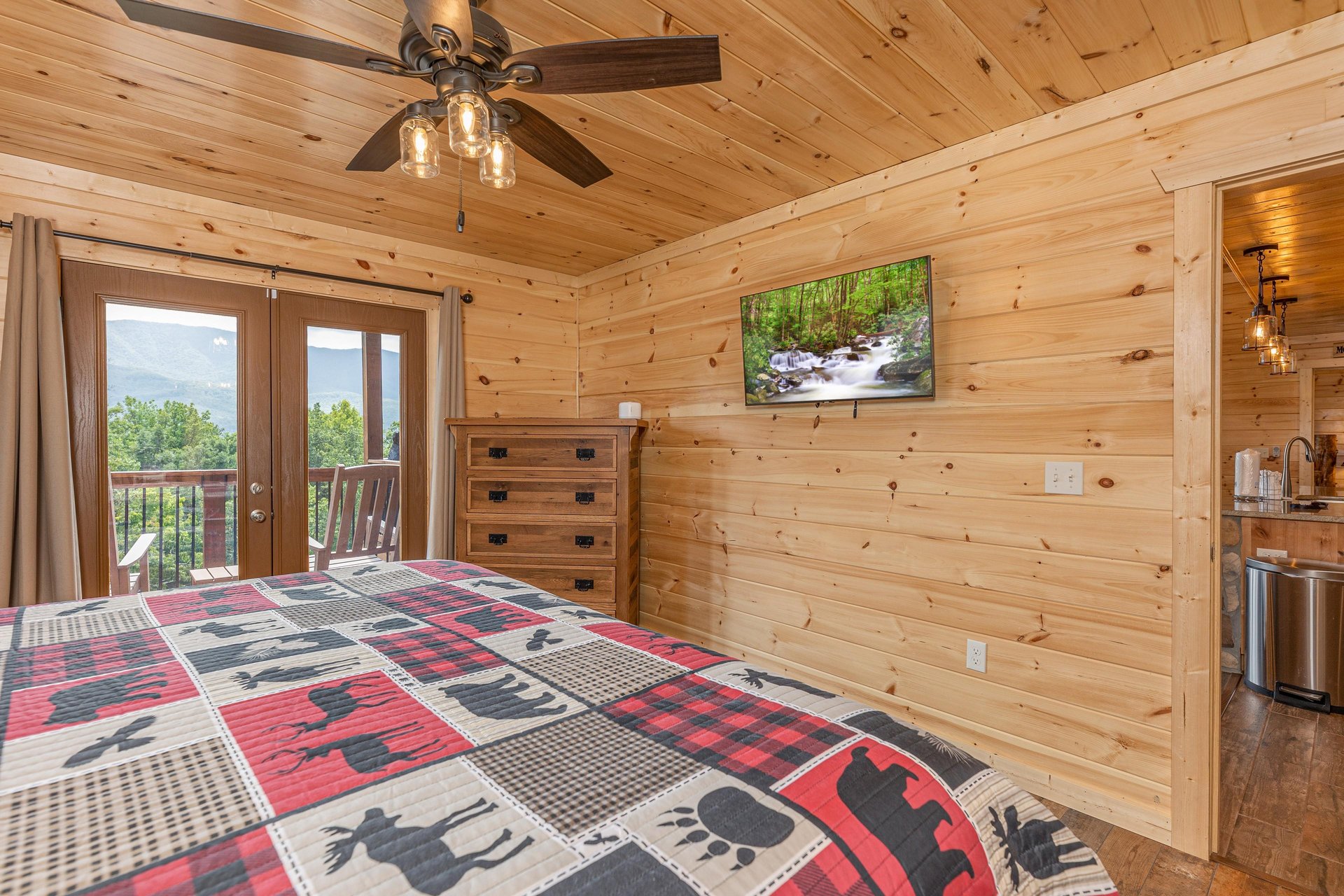 King bed facing dresser and tv