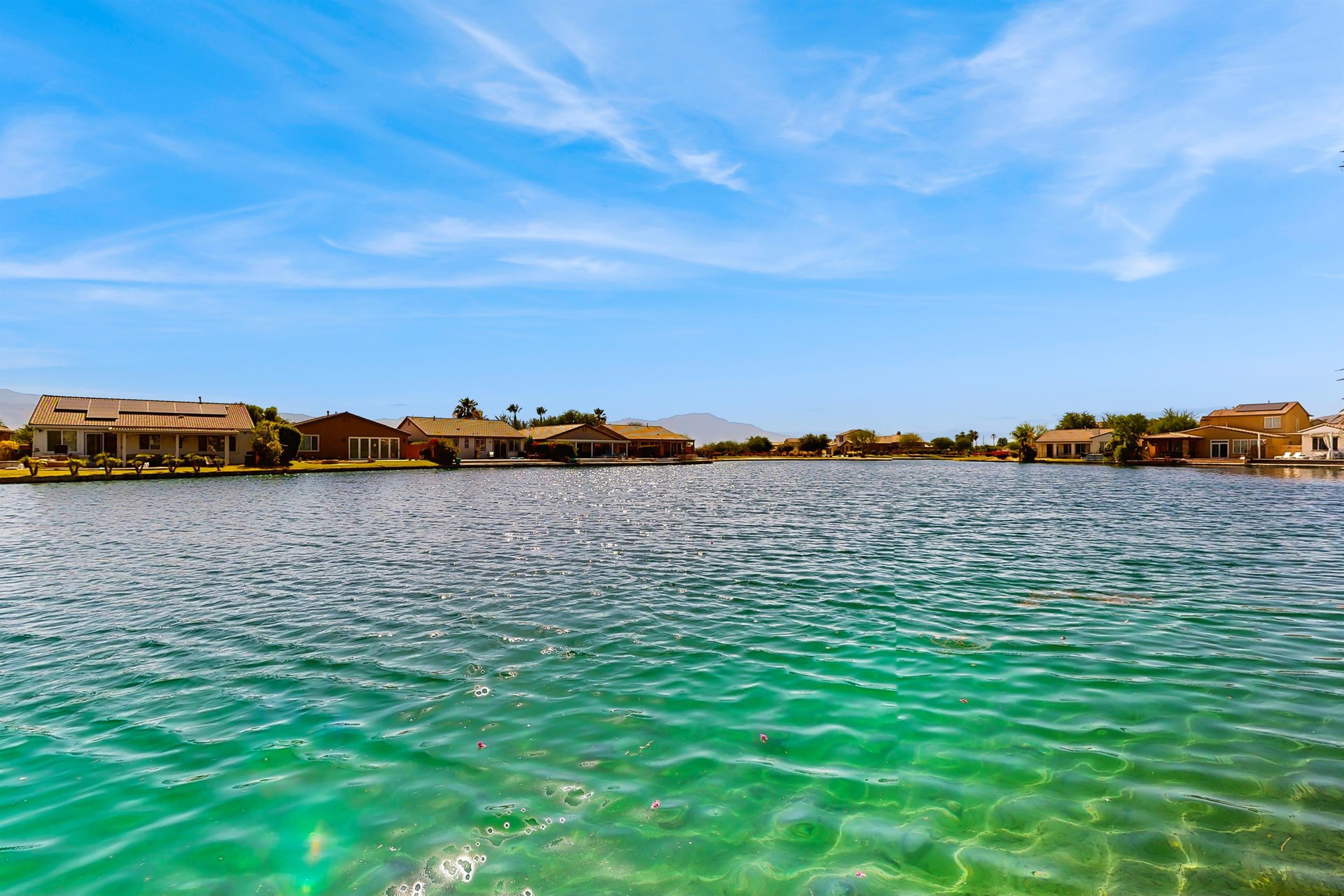 Lake and mountain views can be seen directly from the back of the home.