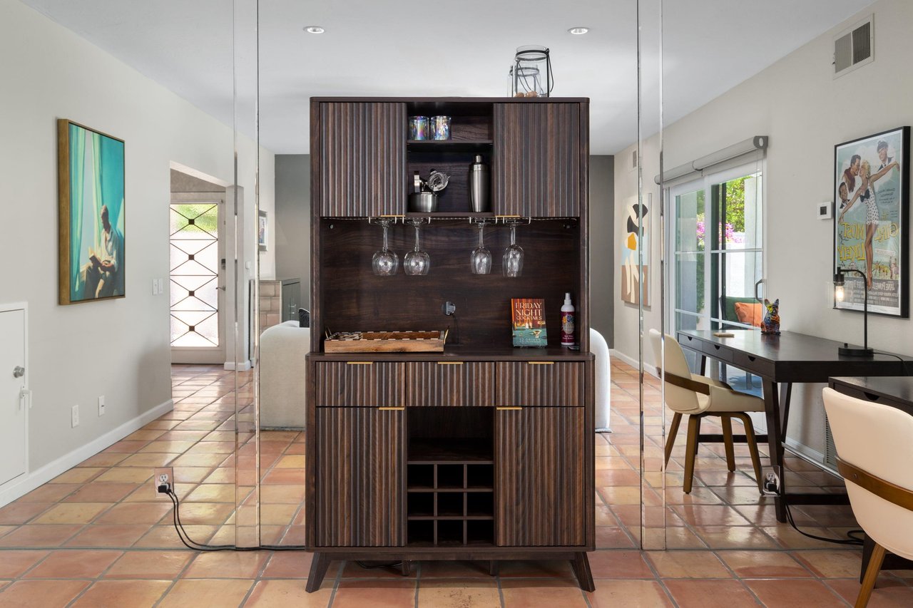 Bar area with wine glasses.