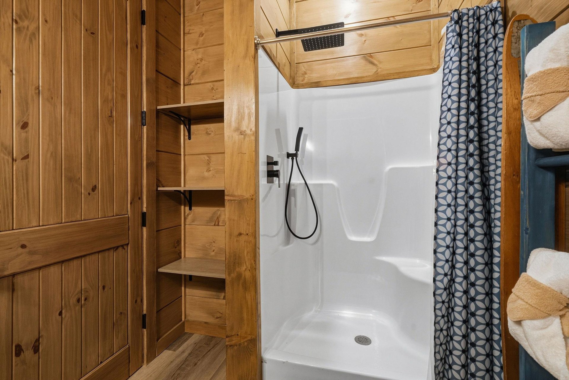 Step into your cozy cabin bathroom with rustic wood charm, spacious shower, and thoughtful storage for all your getaway essentials.