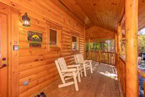 Wooden deck chairs by front door