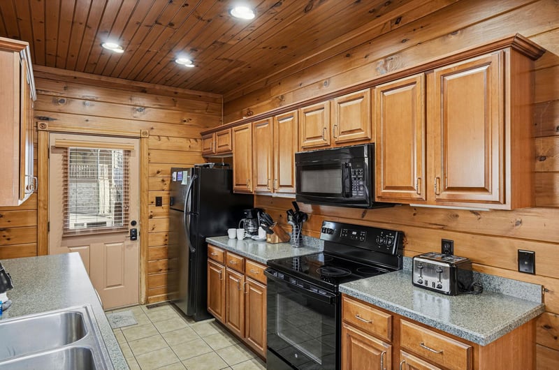 Step into your fully equipped kitchen with warm wood finishes, modern appliances, and everything you need to create memorable meals during your stay.