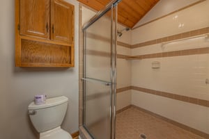 Shower in a bathroom at Cubs Crib, a 3 bedroom cabin rental located in Gatlinburg