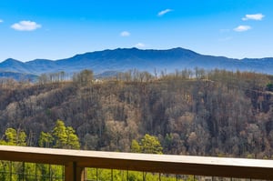 Breathtaking mountain vistas stretch across rolling hills from your private balcony, creating the perfect backdrop for morning coffee.