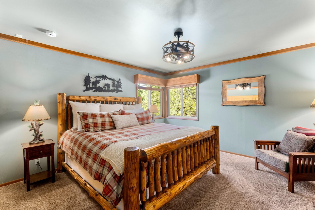 Primary bedroom with king bed and smart TV.