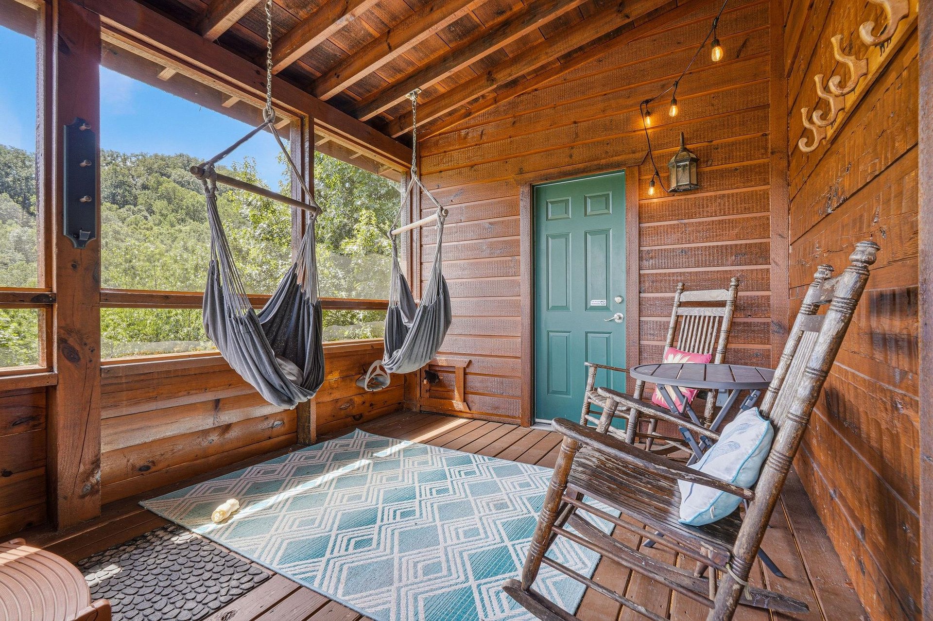 Unwind in your screened porch retreat with hammock swings and rockers—perfect for lazy afternoons surrounded by natures peaceful views.