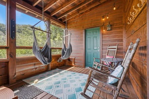 Unwind in your screened porch retreat with hammock swings and rockers—perfect for lazy afternoons surrounded by natures peaceful views.