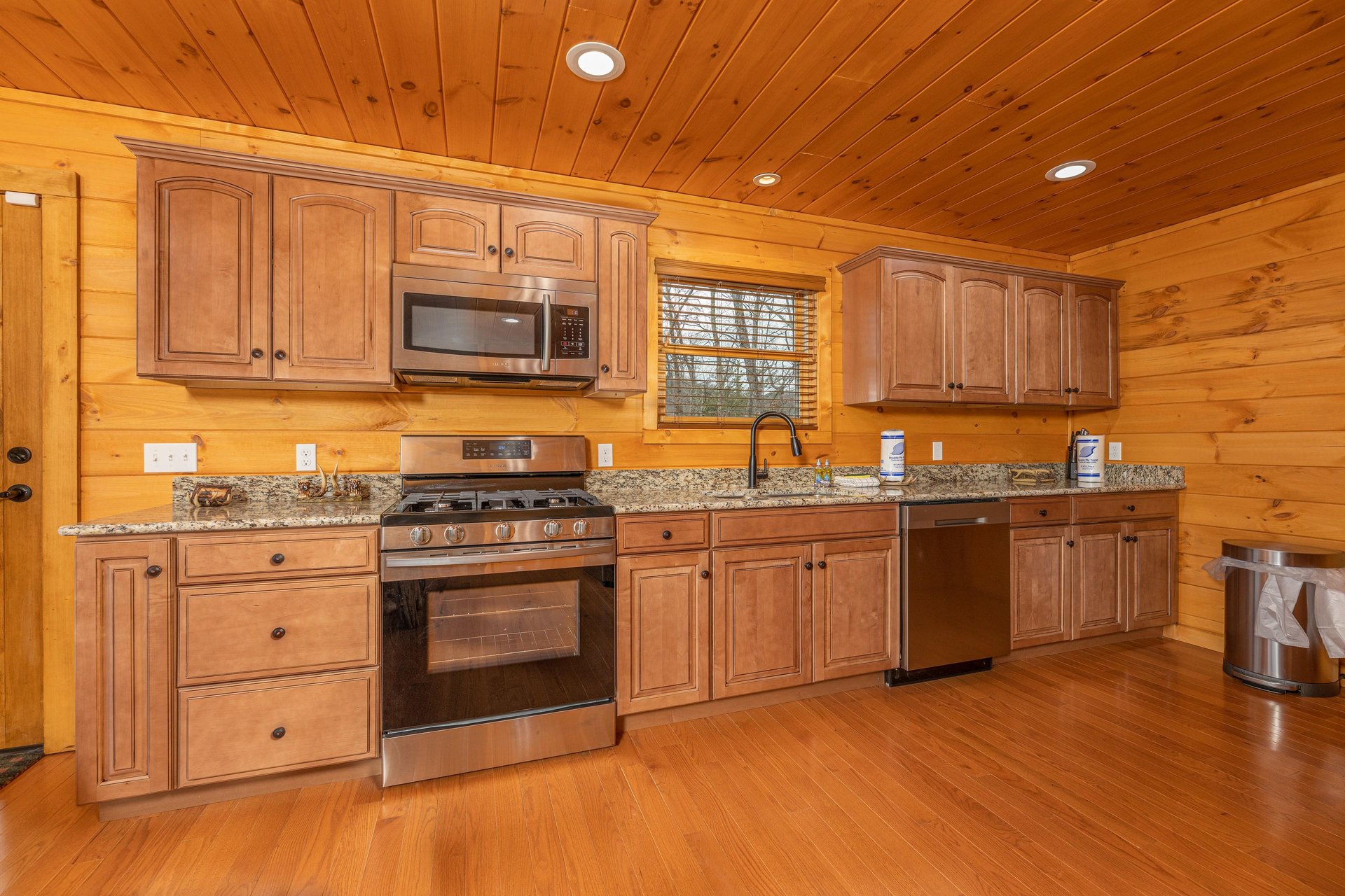 Kitchen with stainless appliances and granite counters at Js Hideaway, a 4 bedroom cabin rental located in Pigeon Forge