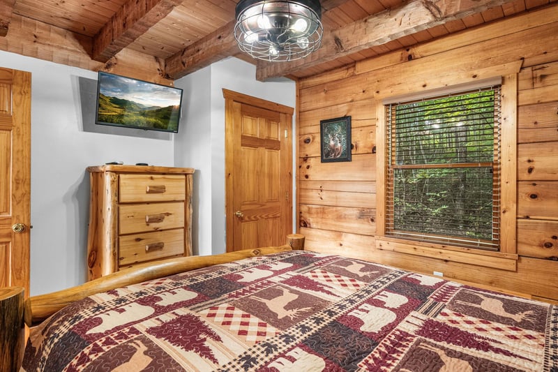 queen bed, dresser and TV