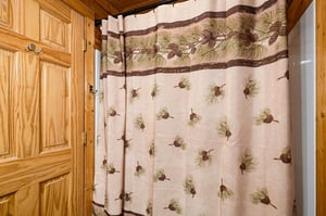Rustic charm meets cozy comfort in your private bath, where warm wood details and natureinspired accents create a peaceful retreat after a day of mountain adventures.
