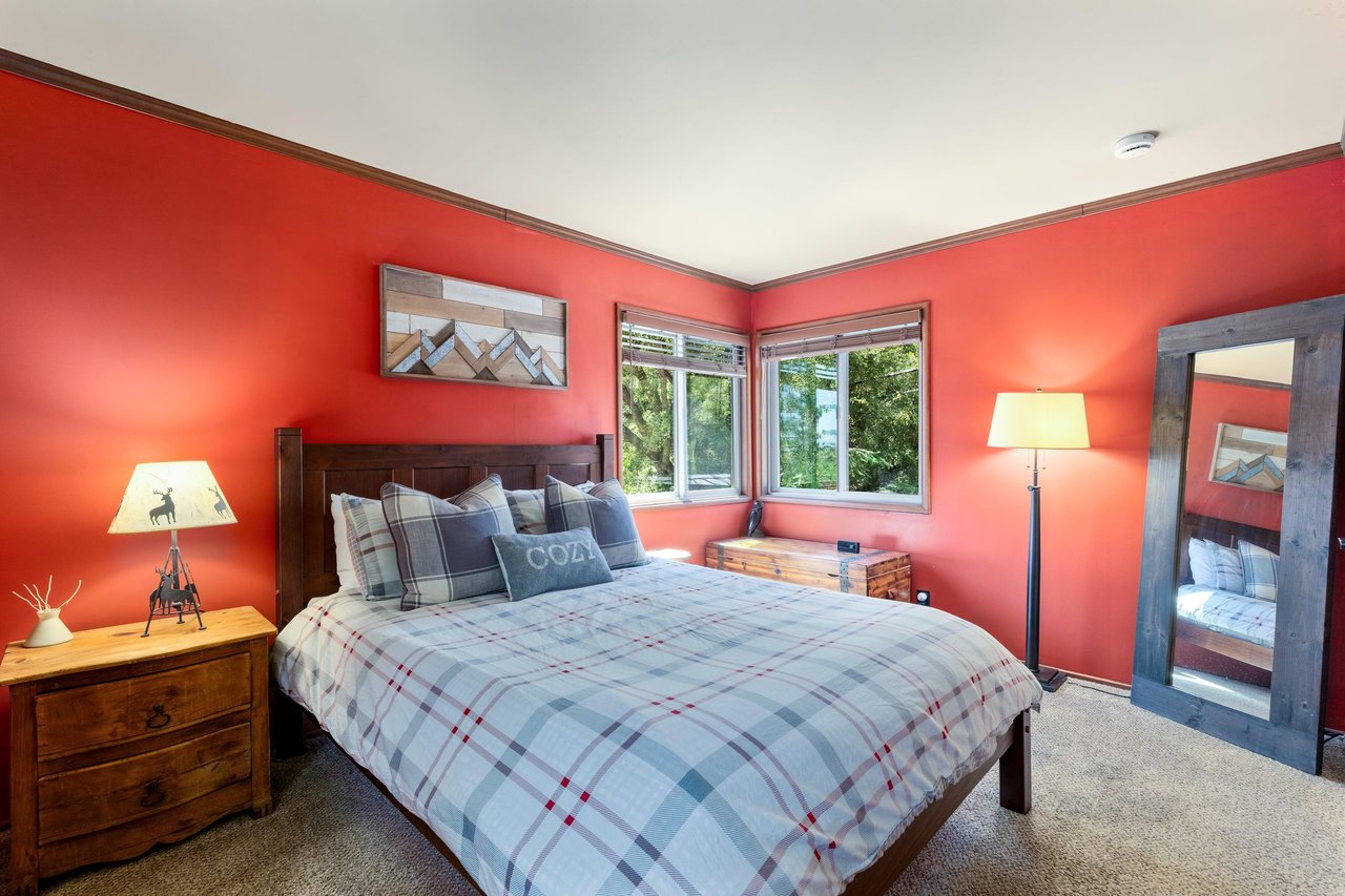 Upstairs second guest bedroom with queen bed.