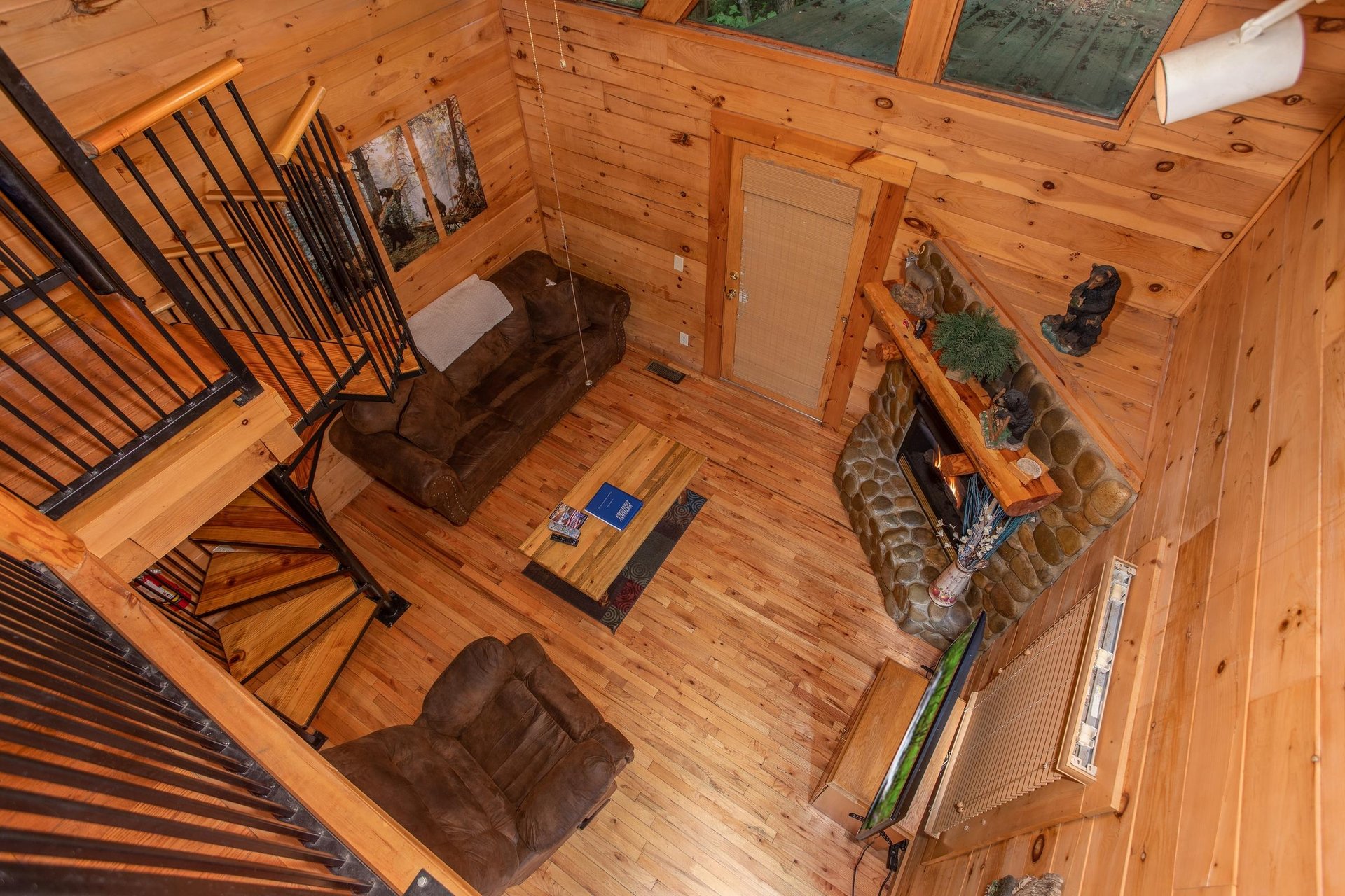 Living room from the game loft at Dreams Do Come True, a 1bedroom cabin rental located in Pigeon Forge