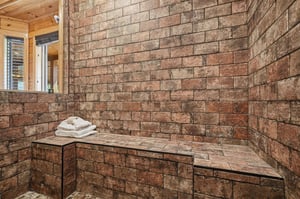 Step into your private sauna, where warm, rustic brick surrounds you in tranquil comfort. Fresh towels await as you unwind and let the gentle heat melt away stress.