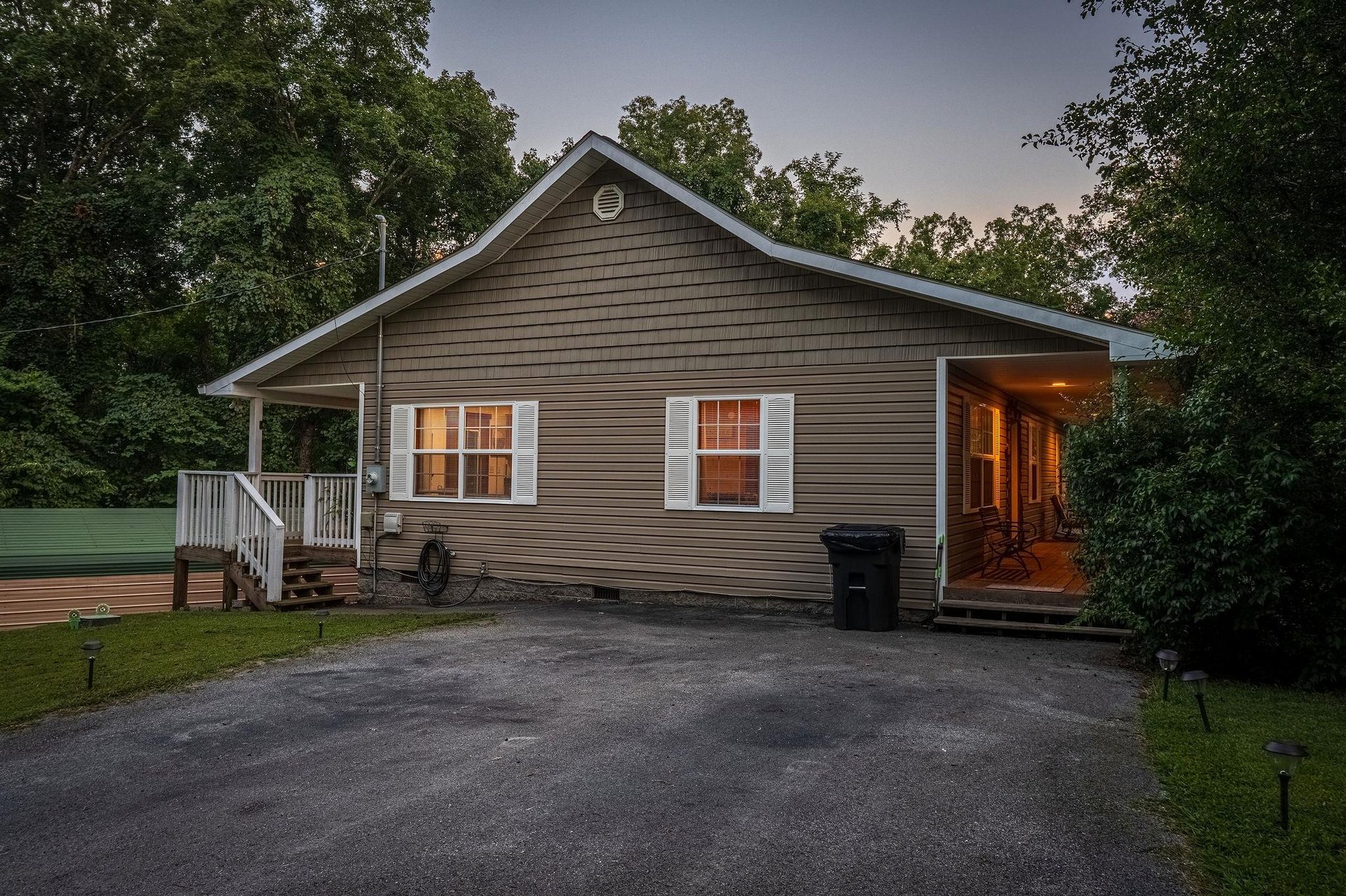 Side of Ole Bud Cabin with parking area