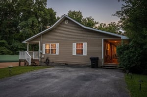 Side of Ole Bud Cabin with parking area