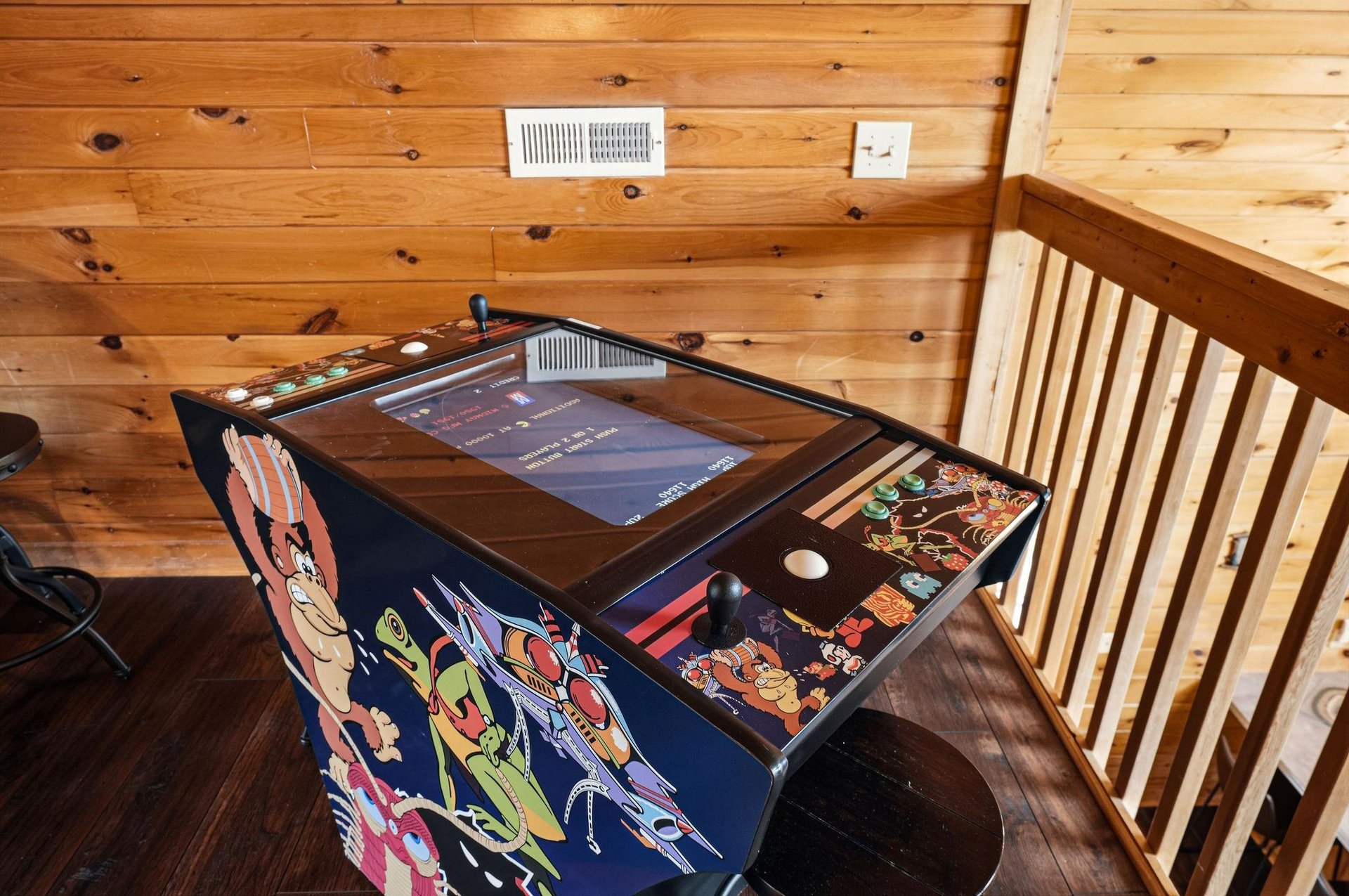 Challenge your friends to classic arcade games in your cozy cabin retreats loft area.