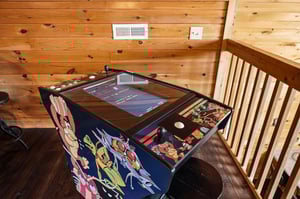 Challenge your friends to classic arcade games in your cozy cabin retreats loft area.