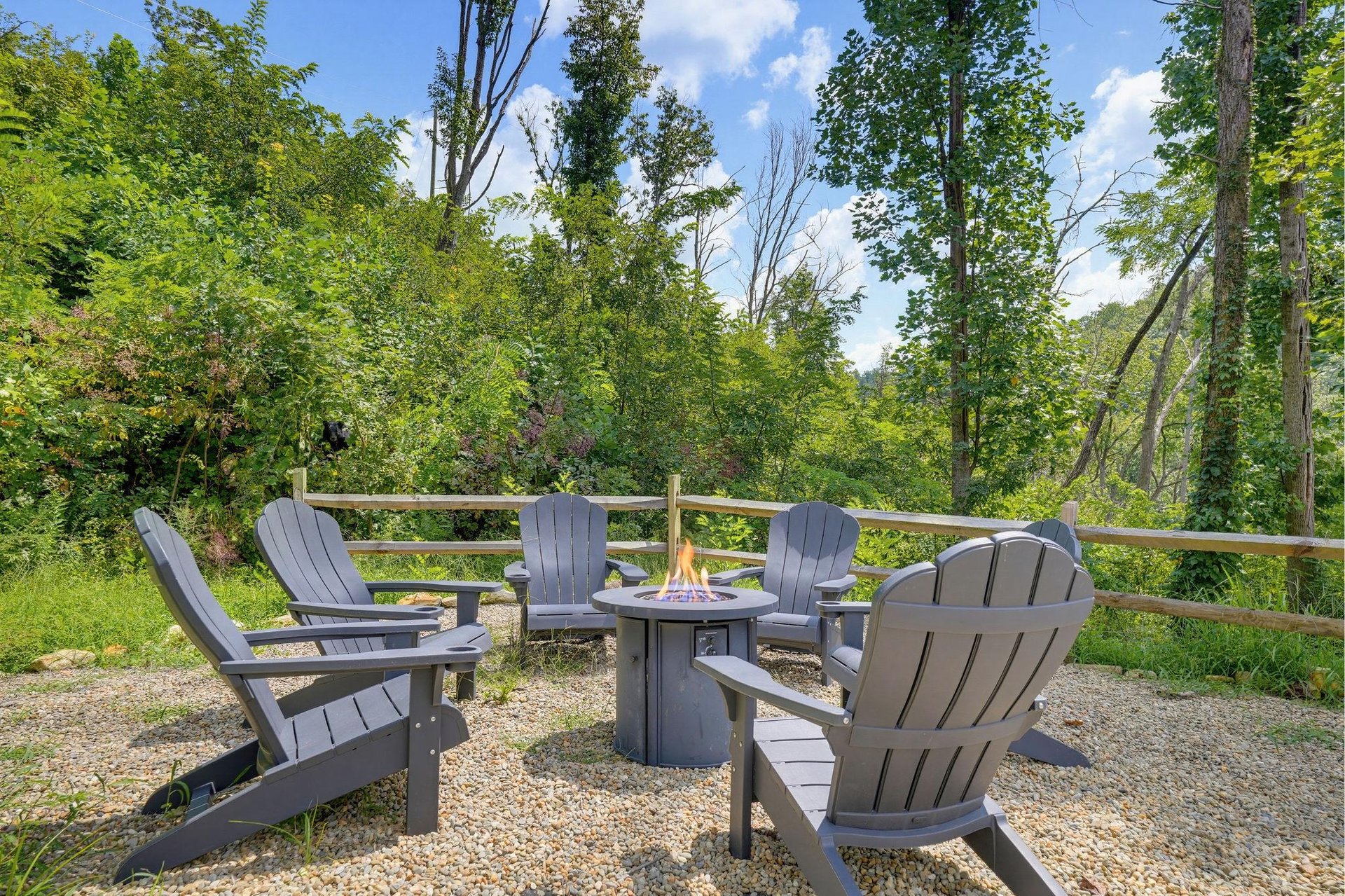 Picture yourself unwinding here with morning coffee or evening stories by the fire pit, surrounded by towering trees and peaceful forest views.