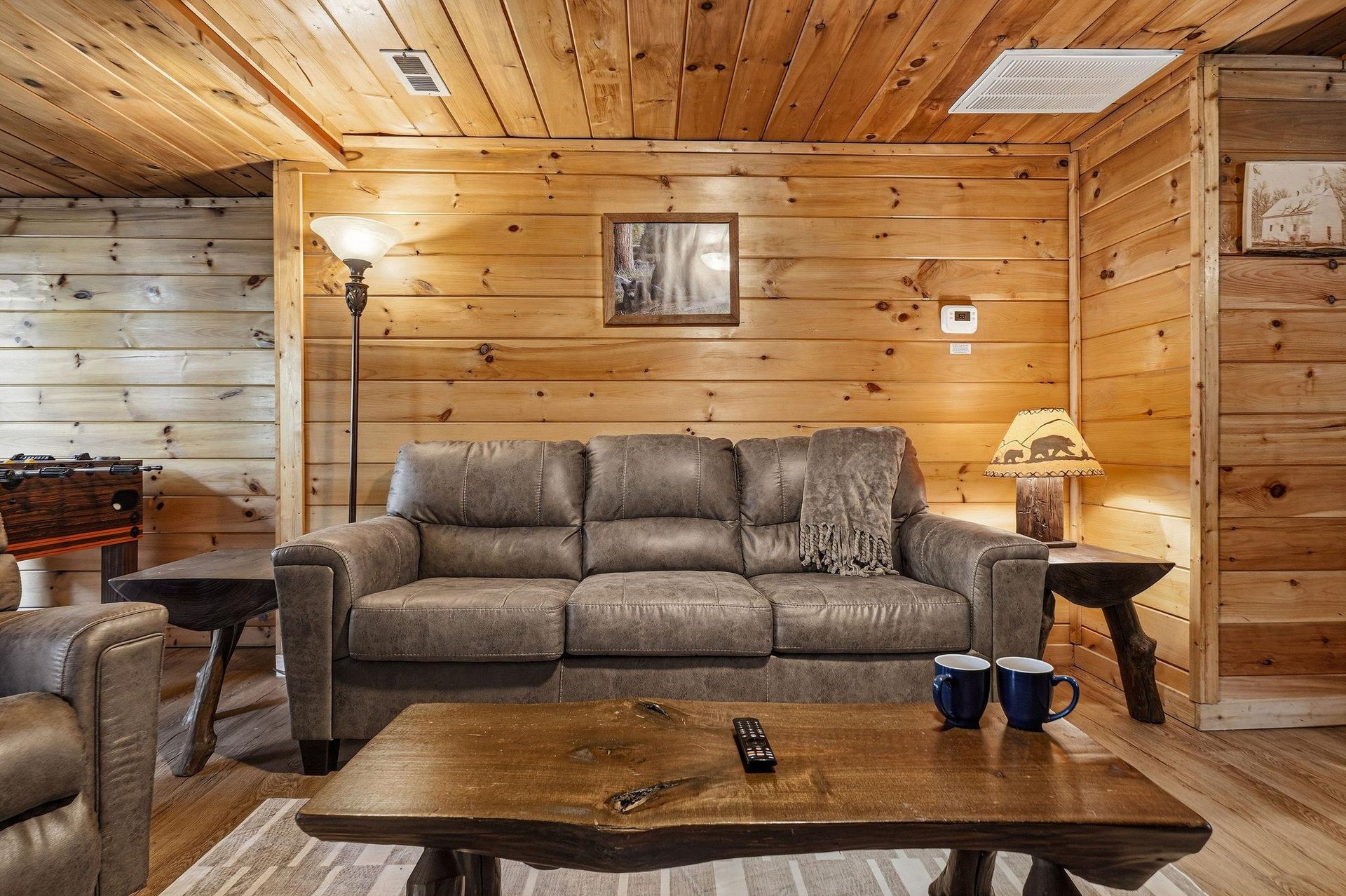 Sink into plush seating surrounded by warm knotty pine walls that create your perfect mountain retreat atmosphere.