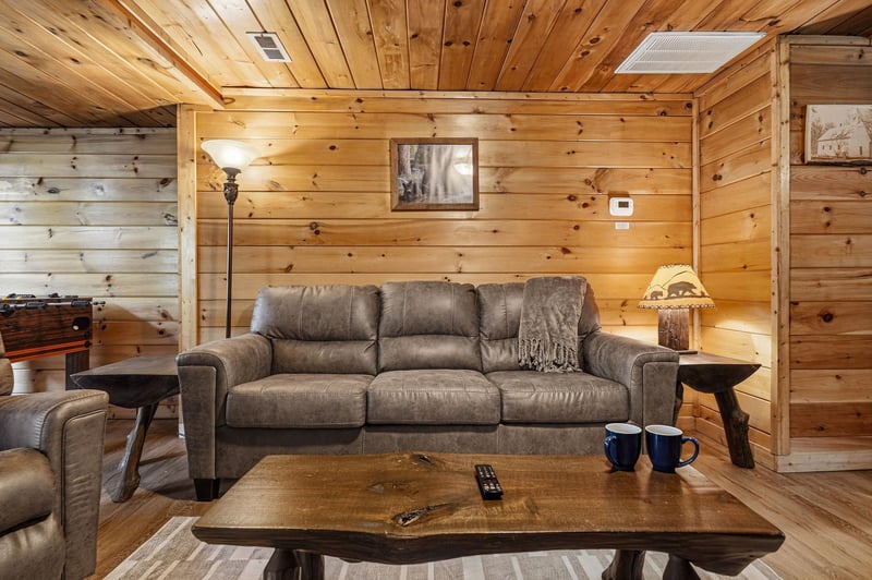 Sink into plush seating surrounded by warm knotty pine walls that create your perfect mountain retreat atmosphere.