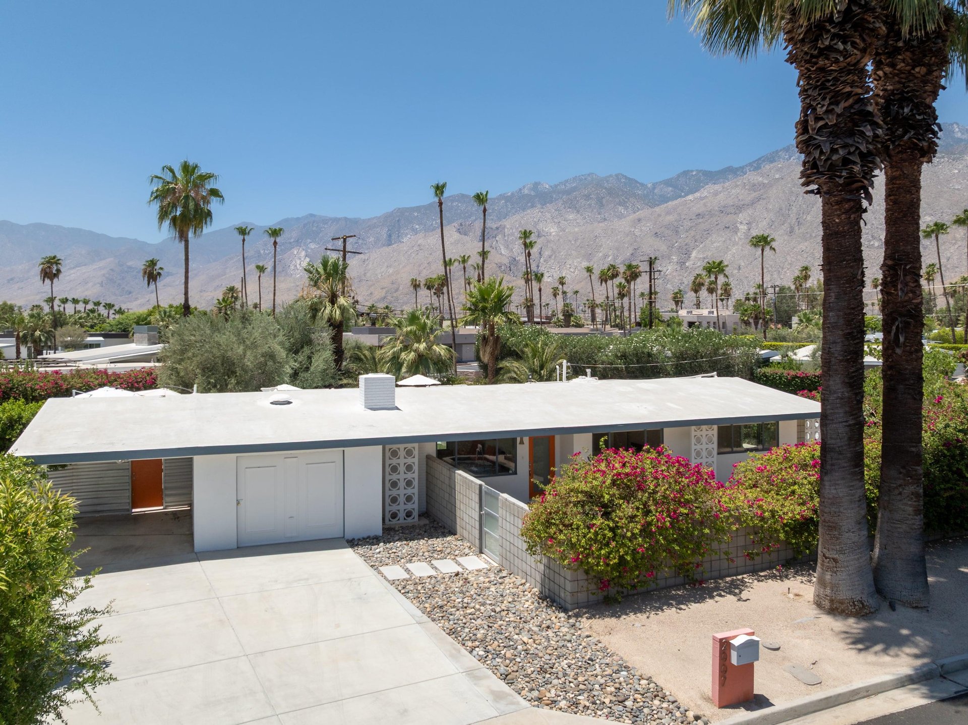 View of the front of the home including the driveway and entrance.